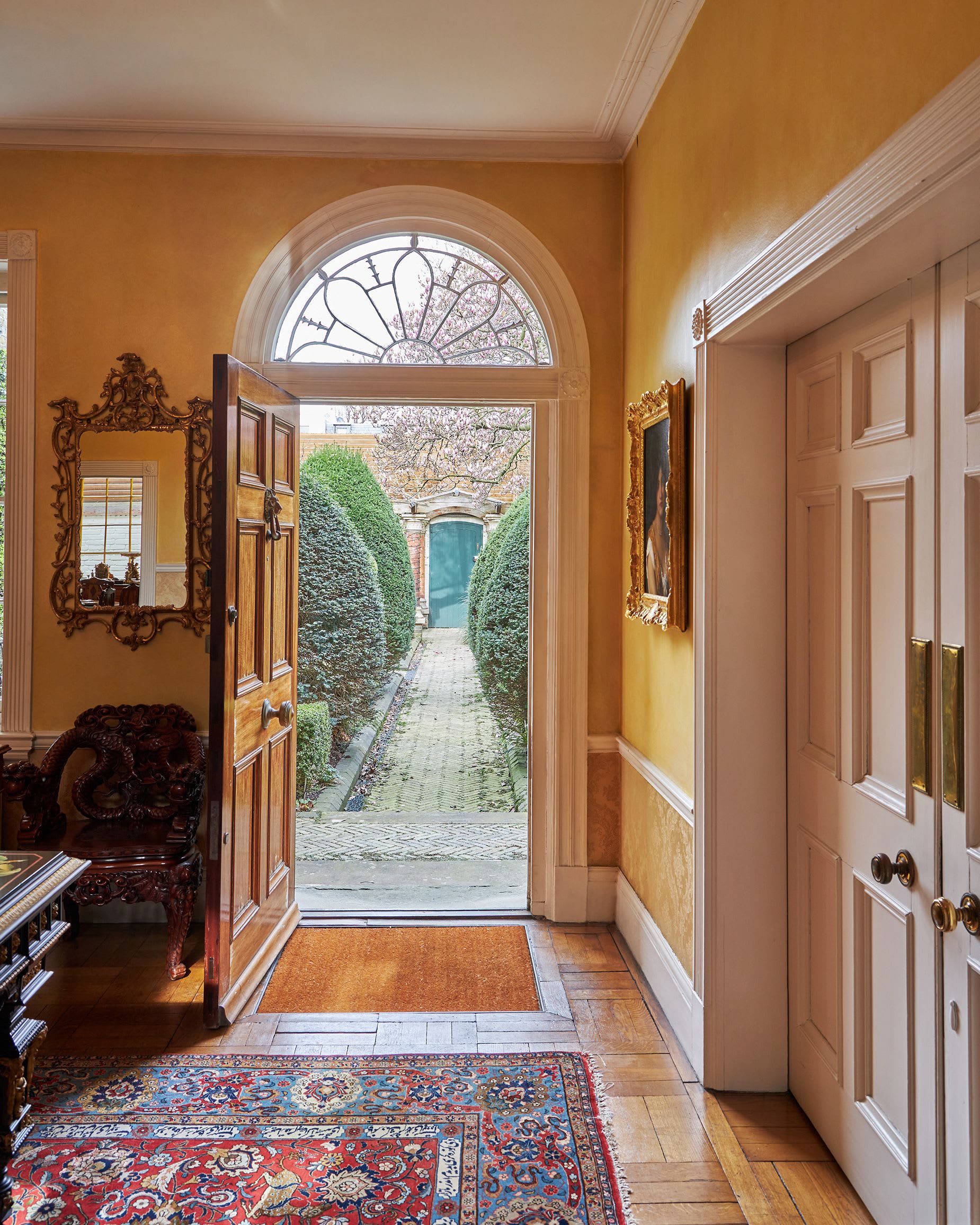 garden-lodge-knight-frank-a-view-from-the-hall-looking-towards-the-famous-green-door-3.jpg