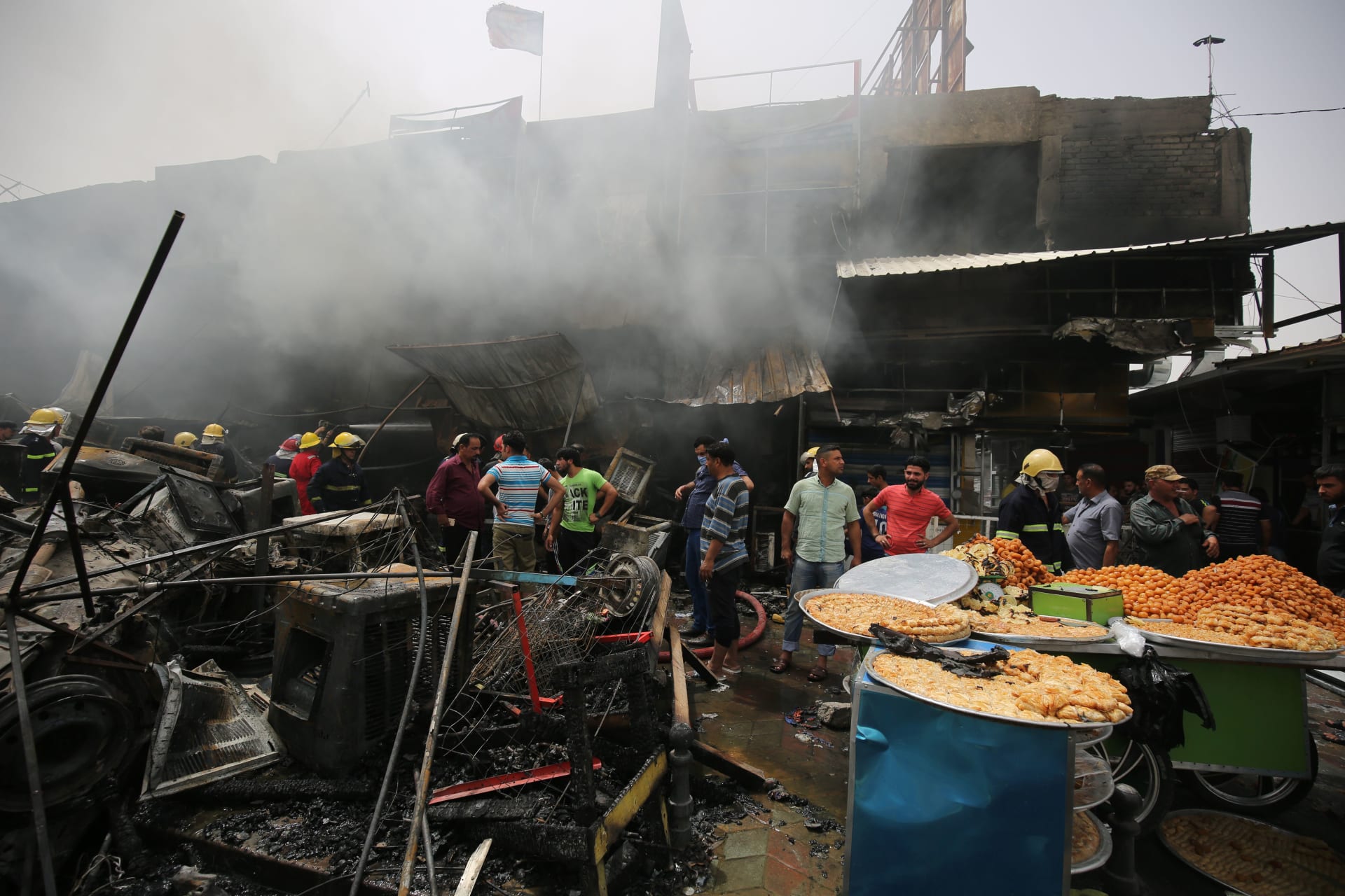 مقتل 22 شخصا وإصابة العشرات إثر تفجيرين انتحاريين في بغداد
