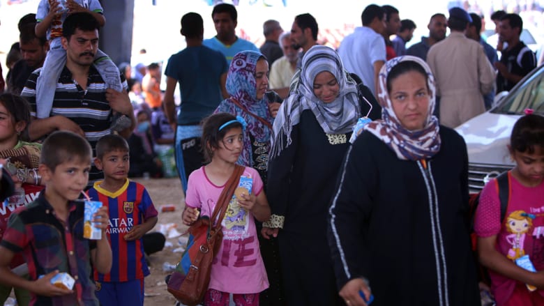 نساء وأطفال فروا من الموصل نساء وأطفال فروا من الموصل