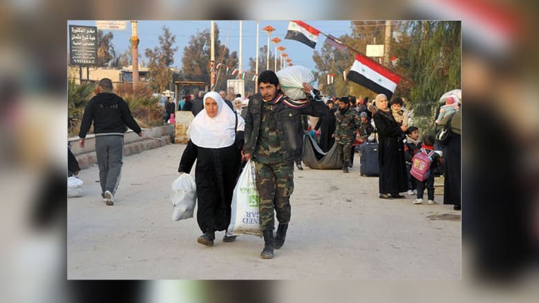 عائلات سورية تعود إلى معضمية الشام