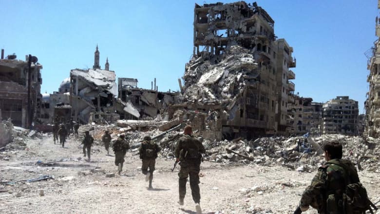 انسحاب مقاتلي المعارضة من حمص يتواصل وغليون يرد: سيعودون منتصرين