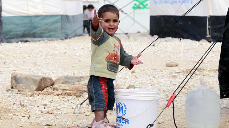 صورة مأخوذة في مارس 2014 لطفل في مخيم الزعتري في شمال الأردن قرب الحدود مع سوريا