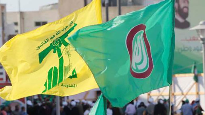 صورة ارشيفية لرايتي حزب الله وحركة أمل