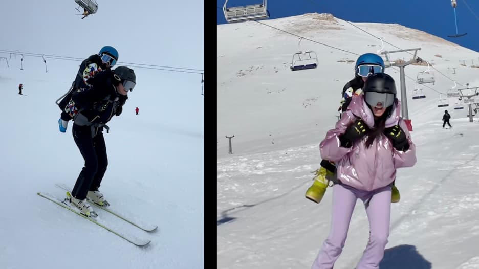 مشهد يجمع بين الأمومة والمهارة.. بطلة تزلج لبنانية تتألق على الثلوج حاملةً طفلها على ظهرها